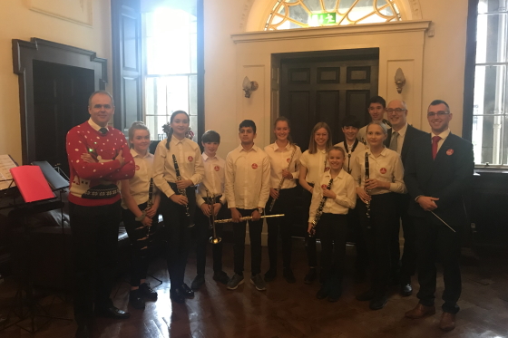 Minister for Education and Skills Joe McHugh TD pictured with members of the Sandyford Youth Band at the Department of Education and Skills in Dublin