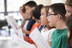 Group school children singing choir together 53308343