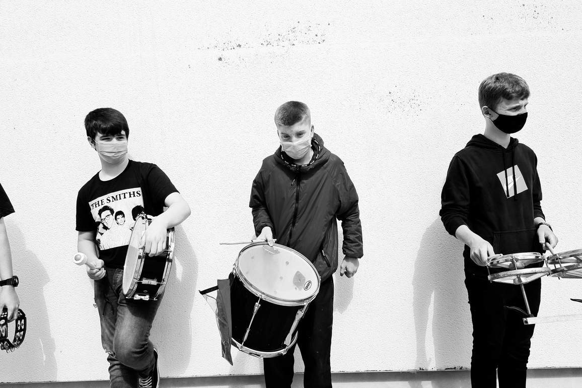 Black and white image of young musicians from the SubSounds Music Collective playing drums.